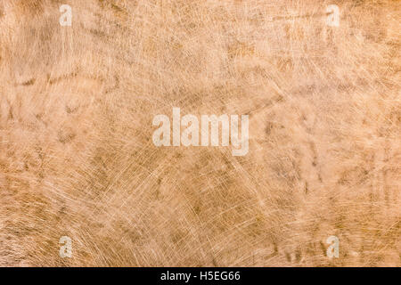 scratched and stained old grungy copper metal plate background Stock Photo