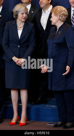 Brussels, Belgium. 20th Oct, 2016. British Prime Minister Theresa May (L) talks with Lithuania's President Dalia Grybauskaite at group photo session during an EU Summit at its headquarters in Brussels, Belgium, Oct. 20, 2016. Credit:  Ye Pingfan/Xinhua/Alamy Live News Stock Photo