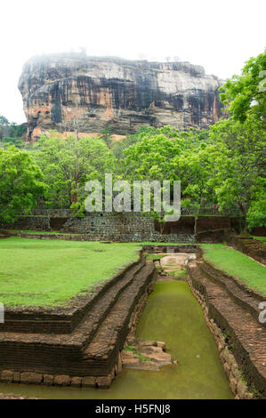 Palace water gardens in front of Sigiriya rock fortress (Lion rock), Sigiriya, Sri Lanka Stock Photo