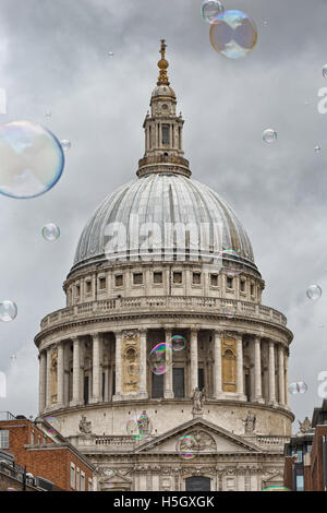 London, UK - July 2016:  Bubbles from a street entertainer, with St Paul's Cathedral in the background, on the South Bank London