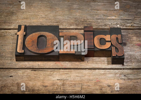 topics, word written with vintage letterpress printing blocks on rustic wooden background Stock Photo