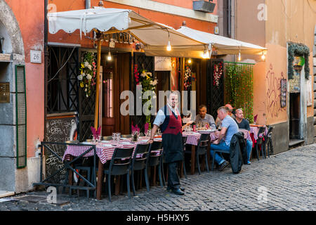 Tourists seated outside a bar in Trastevere district, Rome, Lazio, Italy Stock Photo