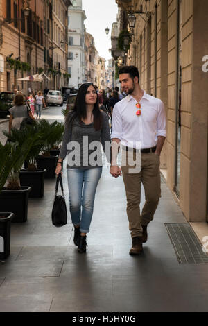 Caucasian young tourist couple walking in the street, Rome, Lazio, Italy Stock Photo