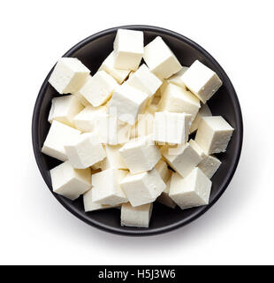 Bowl of diced soft cheese isolated on white background, top view Stock Photo