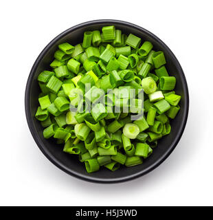 Bowl of chopped spring onions isolated on white background, top view Stock Photo