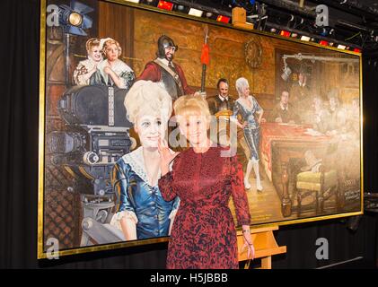 Dame Barbara Windsor unveils the painting 'And When Did You Last See Your Feet?' by artist Nick McCann, a tribute to the Carry On films, at the Comedy Store in London. Stock Photo