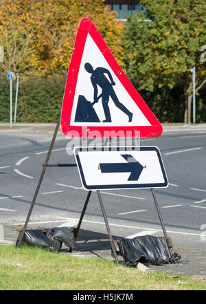 Free standing roadworks sign on a road in the UK. Stock Photo