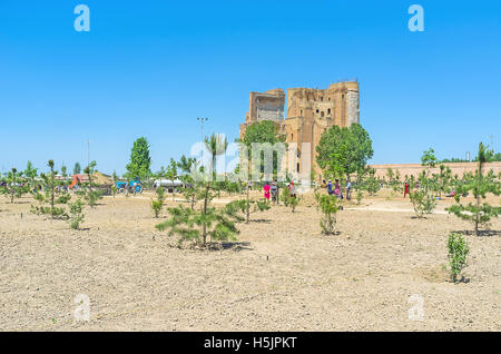 The workers landscape a large park in the old city center, around the ruins of Ak-Saray Palace Stock Photo