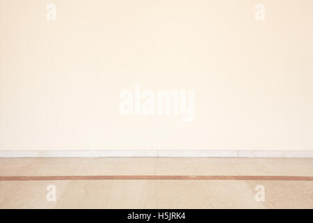 Marble floor in empty room with blank wall Stock Photo