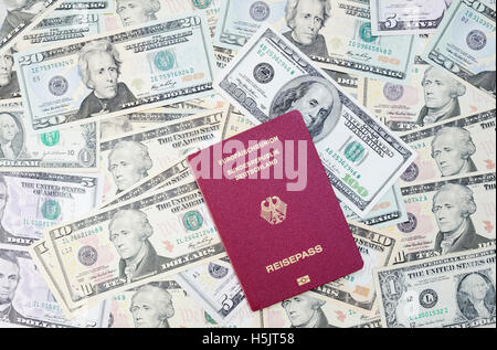 German Passport and US Dollar Bills Stock Photo