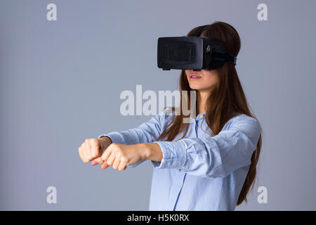 Woman using VR glasses Stock Photo