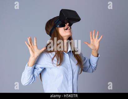 Woman using VR glasses Stock Photo