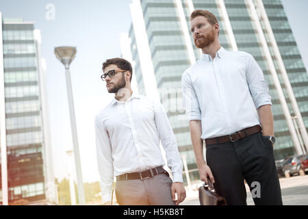 Successful business people outdoors going home Stock Photo