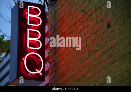 neon bbq sign on brick wall brooklyn new york usa simon leigh Stock Photo