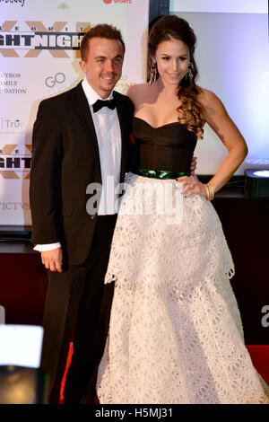 Frankie Muniz and Elycia Marie Turnbow (R) attend the 2015 Celebrity Fight Night red carpet at JW Marriott Desert Ridge Resort and Spa Stock Photo