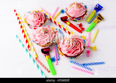 Birthday party concept  with decorated pink cupcakes  and candles. Homemade cupcakes served for party. Birthday greeting  backgr Stock Photo