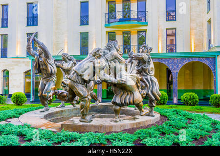 The scenic statue of people, dancing in ring, named Berikaoba (National Holiday), located in front of Children's Art Gallery Stock Photo