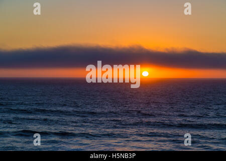 Cloudy sunset over ocean near Cascais, Portugal Stock Photo