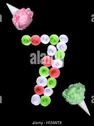 Decorative figure of seven lined paper flowers Stock Photo