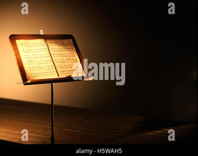 antique music stand with tablature book Stock Photo