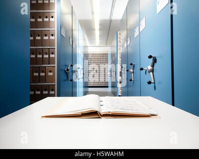 File on a desk in a blue modern archive Stock Photo