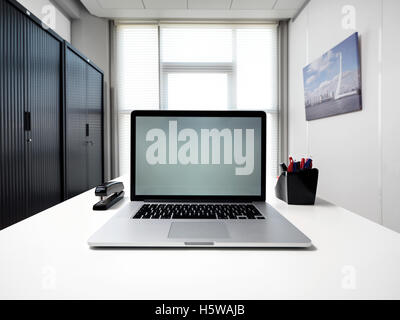 meeting room, in front focus placed with a laptop Stock Photo