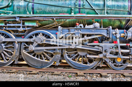 Wheels of a green steam locomotive. HDR image. Stock Photo