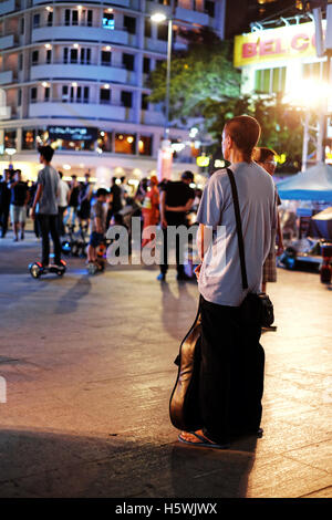 Man artist standing alone in the street Stock Photo