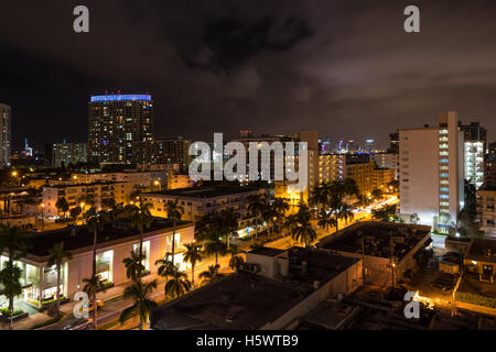 Long exposition night shot of Miami Beach, Florida, with Downtown Miami skyscrapers in the distance. Stock Photo