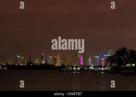 Long exposition night shot of Downtown Miami, Florida, seen from Miami Beach. Stock Photo