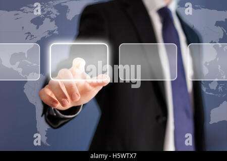 Businessman pushing touch screen button Stock Photo