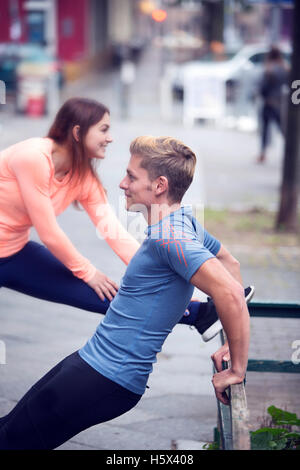 young couple doing workout outdoors in the street Stock Photo