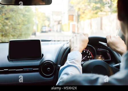 Close-up of Young man driving on the road Stock Photo