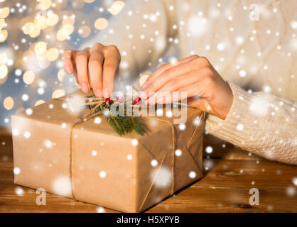 close up of woman with christmas gift or parcel Stock Photo