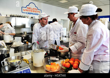 Students at work during a practical lesson at the Carpigiani Gelato University in Anzola nell'Emilia, Italy Stock Photo