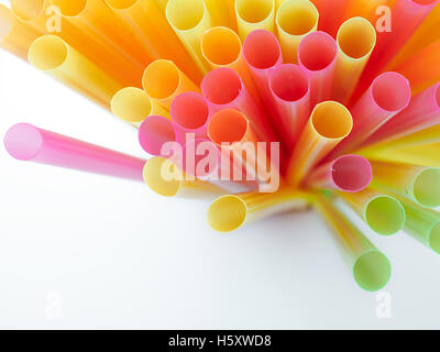 Colored plastic drinking straws on a white background Stock Photo