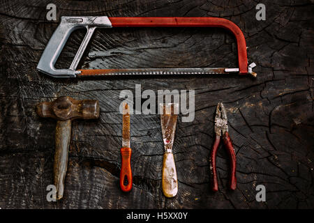 Set of manual tools on a dark wooden background. Stock Photo