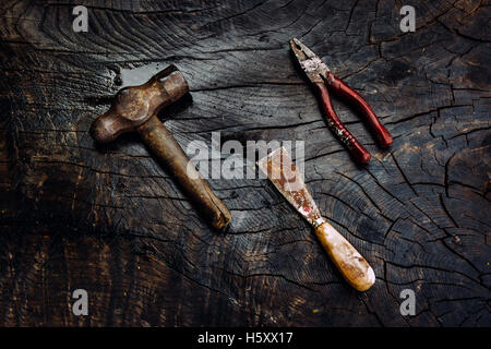 Set of manual tools on a dark wooden background. Stock Photo