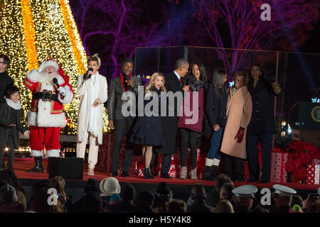 (L-R) Santa Claus, Andra Day, Aloe Blacc, Reese Witherspoon, President Barack Obama, Malia Obama, Sasha Obama, Marian Robinsonon and Michelle Obama on stage at the 2015 National Christmas Tree Lighting on December 3rd, 2015 in Washington D.C. Stock Photo