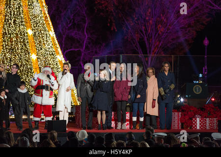 (L-R) Santa Claus, Andra Day, Aloe Blacc, Reese Witherspoon, President Barack Obama, Malia Obama, Sasha Obama, Marian Robinsonon and Michelle Obama on stage at the 2015 National Christmas Tree Lighting on December 3rd, 2015 in Washington D.C. Stock Photo