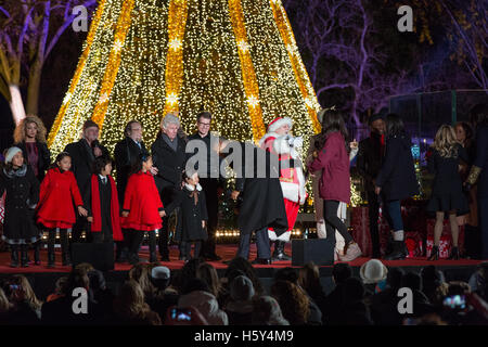 (L-R) Tori Kelly, David Crosby, Stephen Stills, Graham Nash,  President Barack Obama, Santa Claus, Malia Obama, Andra Day, Aloe Blacc, Sasha Obama, Reese Witherspoon and Marian Robinsonon on stage at the 2015 National Christmas Tree Lighting on December 3 Stock Photo