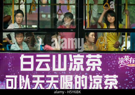 People inside of the city bus of Xian, Shaanxi Province, China. Stock Photo