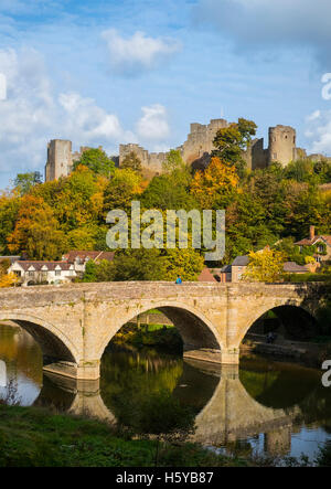 Ludlow Castle amid autumn colour overlooking Dinham Bridge reflected in the River Teme, Shropshire, UK Stock Photo