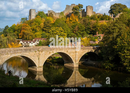 Ludlow Castle amid autumn colour overlooking Dinham Bridge reflected in the River Teme, Shropshire, UK Stock Photo