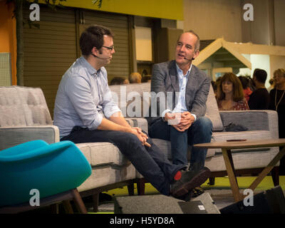 Birmingham, UK. 21st October, 2016. Kevin McCloud, presenter of Grand Designs, interviews architect Matt White in front of a live audience as part of the Grand Designs Live exhibition. The show offers visitors a unique opportunity to see all the latest trends for the home as well as many products never seen before. Based on the Channel 4 TV series, and presented by design guru Kevin McCloud, the event is packed with over 500 exhibitors and is open until 23rd October 2016. Photo Bailey-Cooper Photography/Alamy Live News Stock Photo