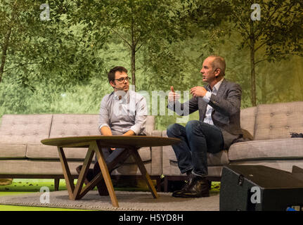 Birmingham, UK. 21st October, 2016. Kevin McCloud, presenter of Grand Designs, interviews architect Matt White in front of a live audience as part of the Grand Designs Live exhibition. The show offers visitors a unique opportunity to see all the latest trends for the home as well as many products never seen before. Based on the Channel 4 TV series, and presented by design guru Kevin McCloud, the event is packed with over 500 exhibitors and is open until 23rd October 2016. Photo Bailey-Cooper Photography/Alamy Live News Stock Photo