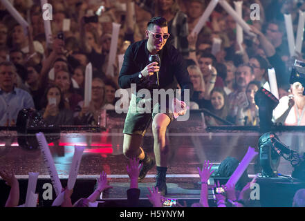 Dortmund, Germany. 21st Oct, 2016. Schlager singer Andreas Gabalier performing during the shooting of the TV show 'Schlagerboom - Das internationale Schlagerfest' at Westfalenhalle in Dortmund, Germany, 21 October 2016. The music TV show will be broadcasted on ARD on 22 October 2016. PHOTO: WOLFRAM KASTL/dpa/Alamy Live News Stock Photo