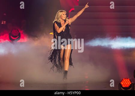 Dortmund, Germany. 21st Oct, 2016. Schlager singer Helene Fischer performing during the shooting of the TV show 'Schlagerboom - Das internationale Schlagerfest' at Westfalenhalle in Dortmund, Germany, 21 October 2016. The music TV show will be broadcasted on ARD on 22 October 2016. PHOTO: WOLFRAM KASTL/dpa/Alamy Live News Stock Photo