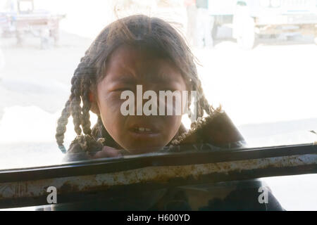 Portrait of a curious young Tibetan girl. Stock Photo