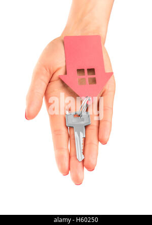 Hand holds key with a keychain in the shape of a house on a white background. Stock Photo